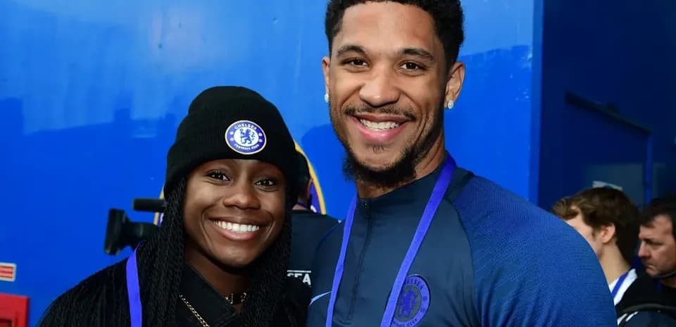 Two individuals smiling together at Chelsea event