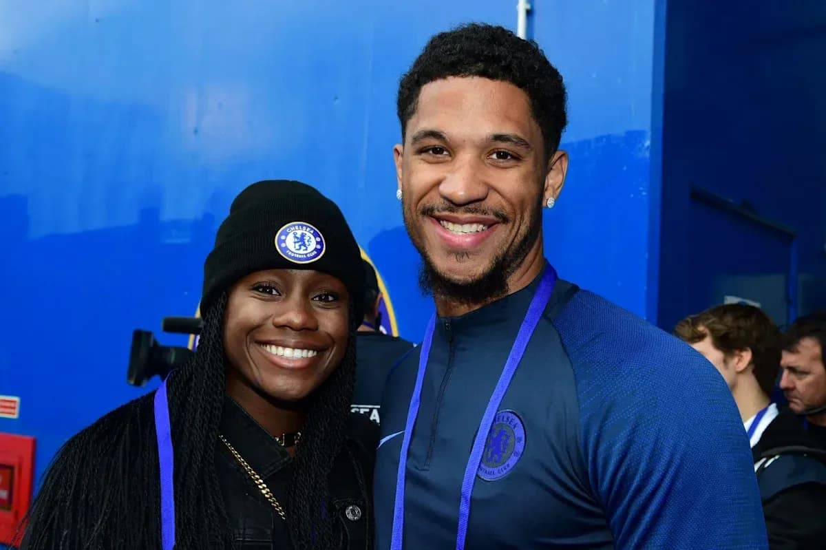 Two individuals smiling together at Chelsea event