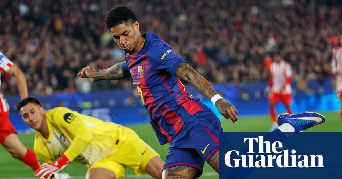 Barcelona player shooting towards goal past goalkeeper