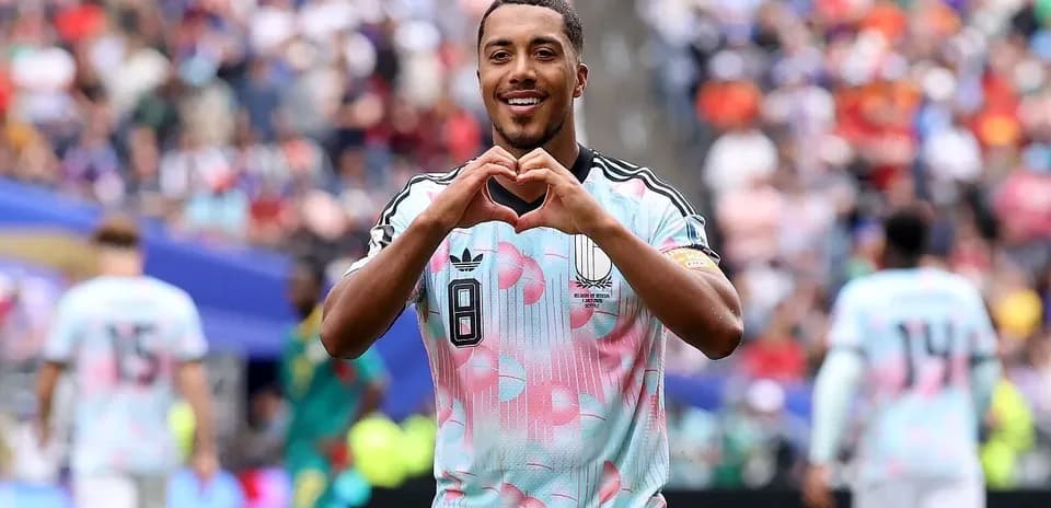 Player celebrating with heart gesture after scoring