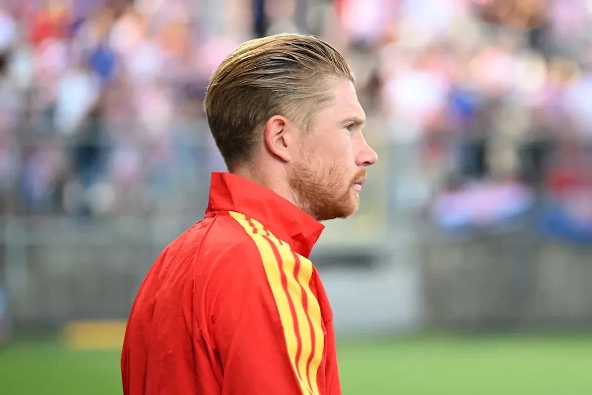 Player in red training kit during warm-up
