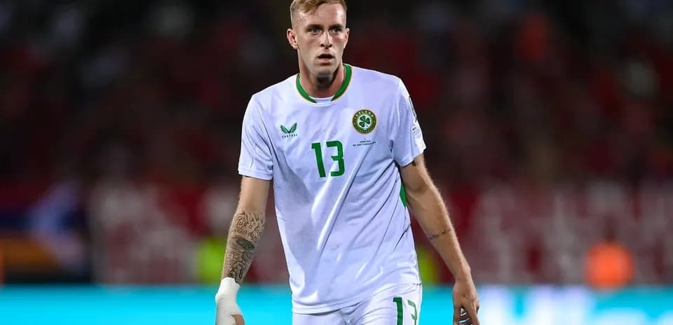 Player wearing white jersey during football match