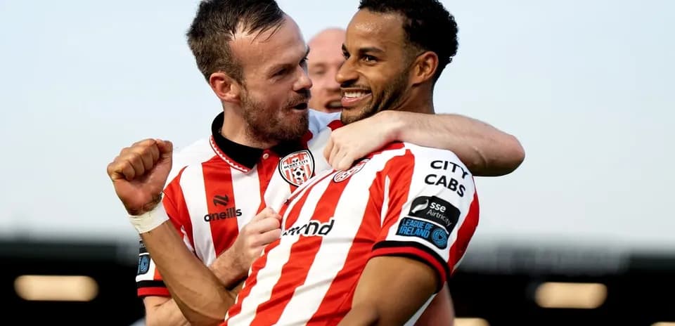 Two players celebrating after scoring a goal