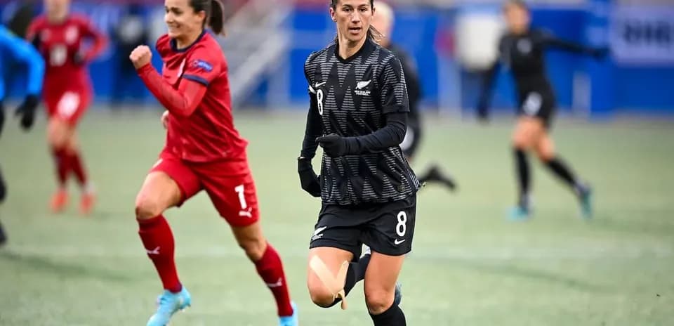 New Zealand player dribbling during a match