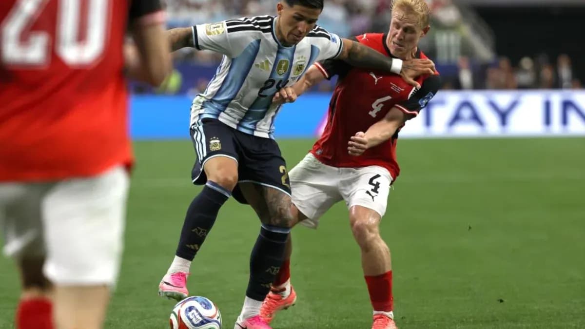 Player dribbling the ball while being challenged
