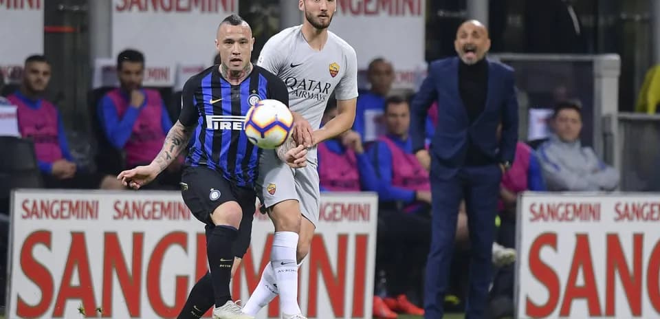 Players competing for the ball during Serie A match