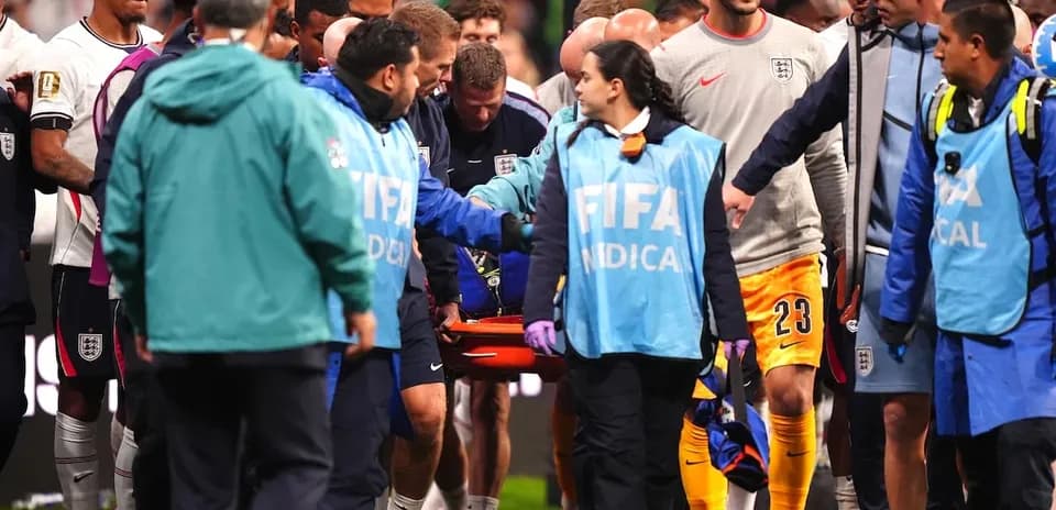 Medical team carrying injured player off the field