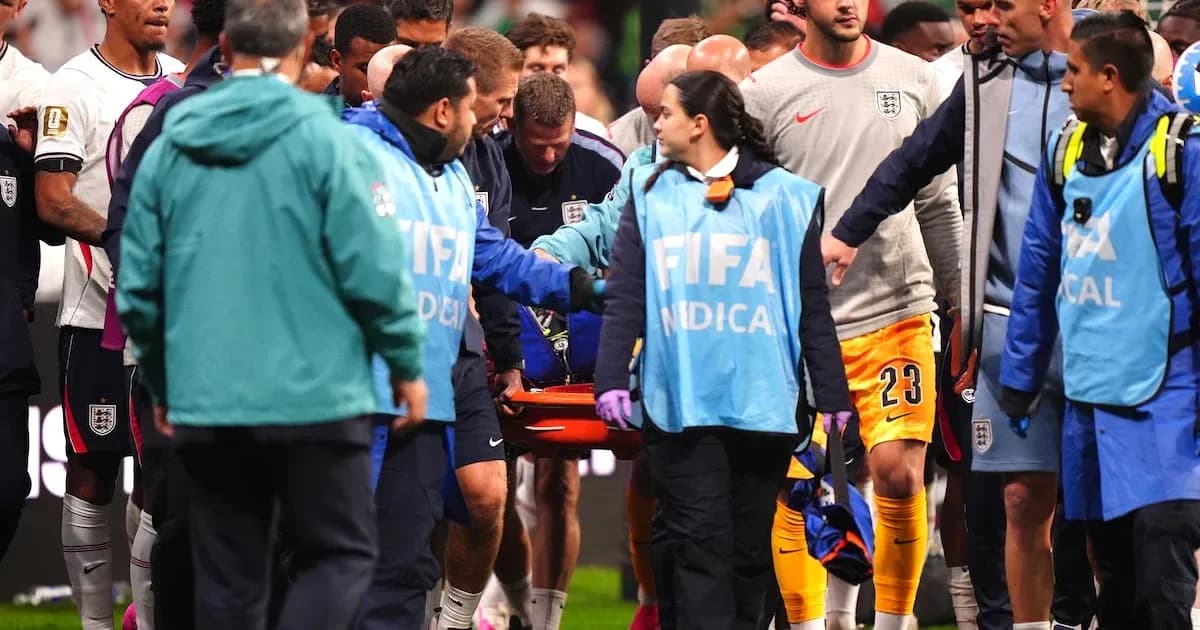 Medical team carrying injured player off the field