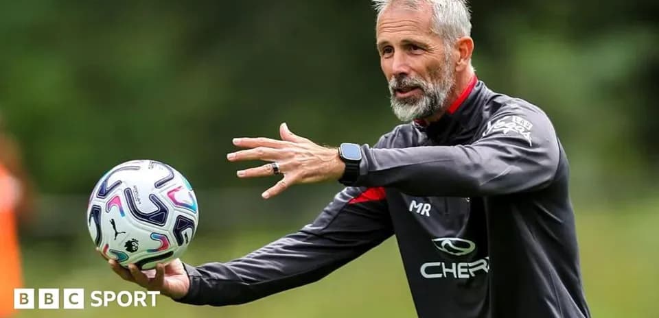 Coach demonstrating ball technique during training session