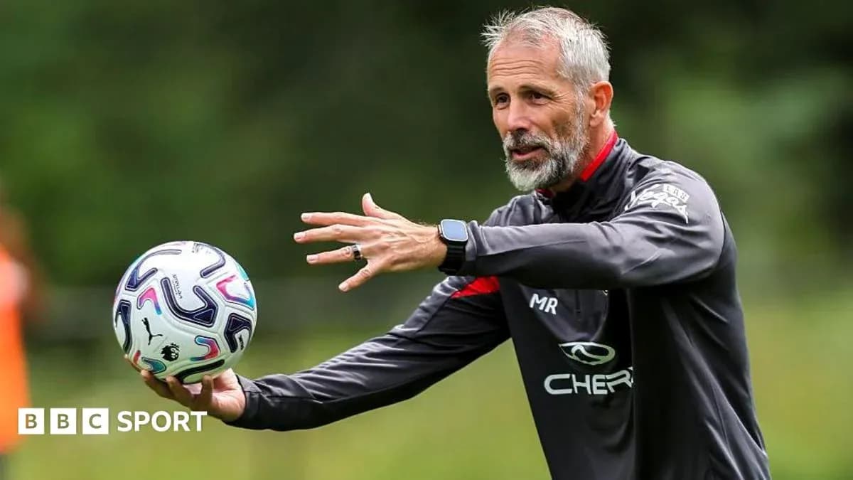 Coach demonstrating ball technique during training session