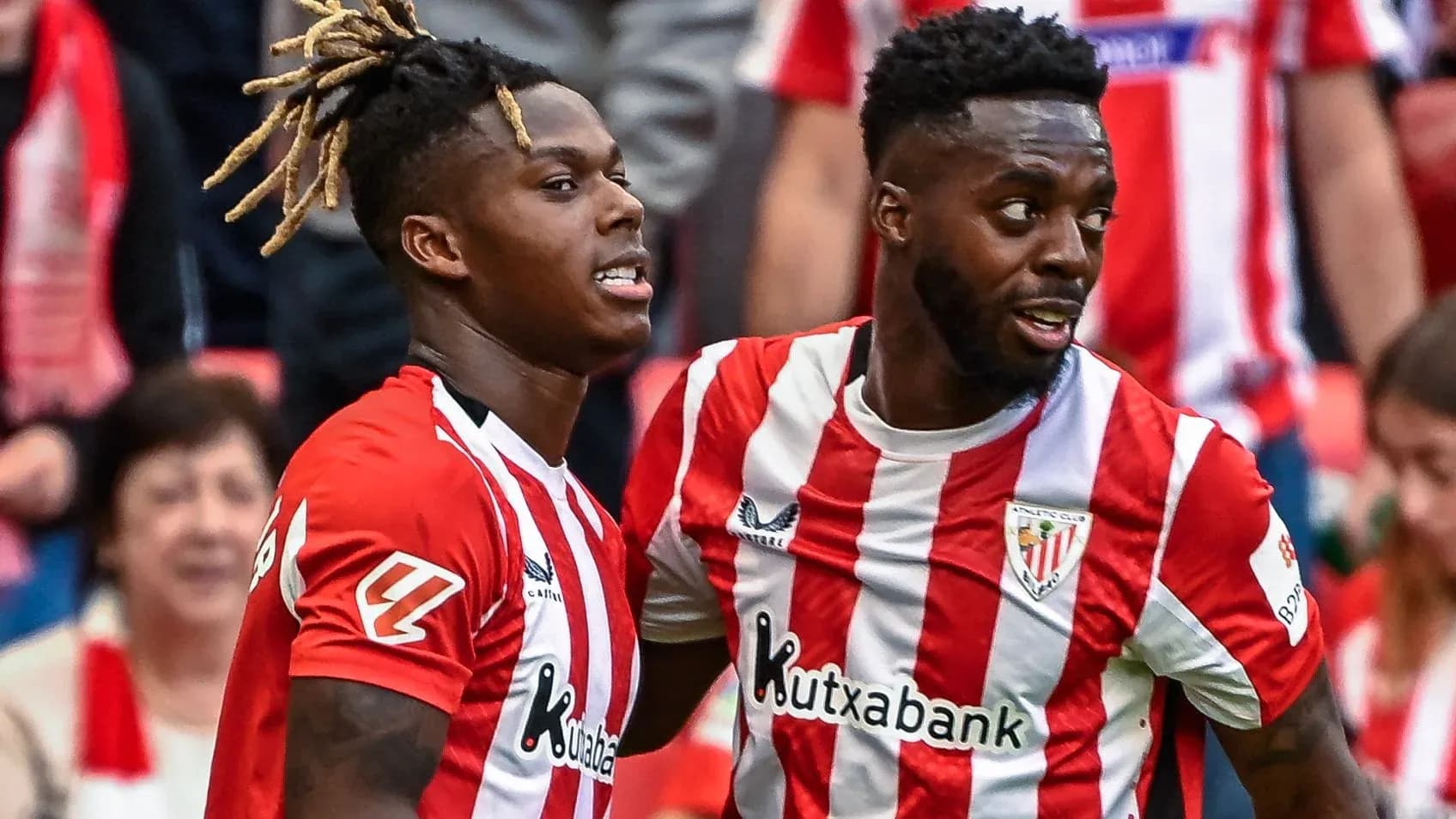Two players celebrating during a football match