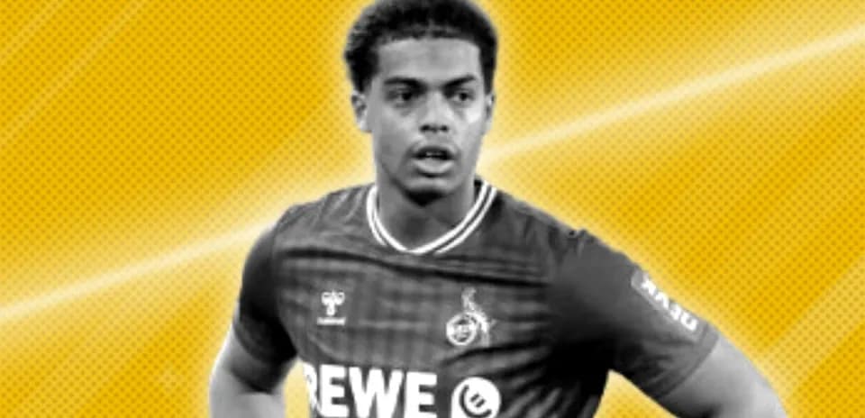 Player in jersey with REWE logo on field
