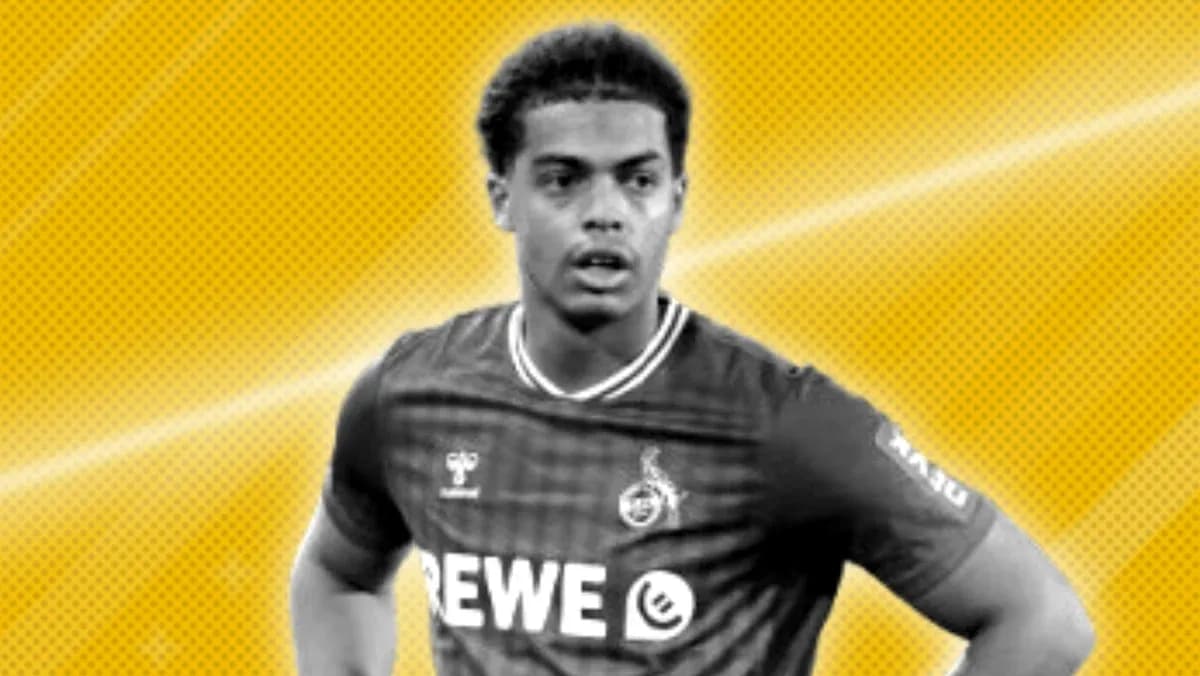 Player in jersey with REWE logo on field