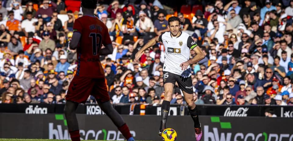 Valencia player dribbling during La Liga match
