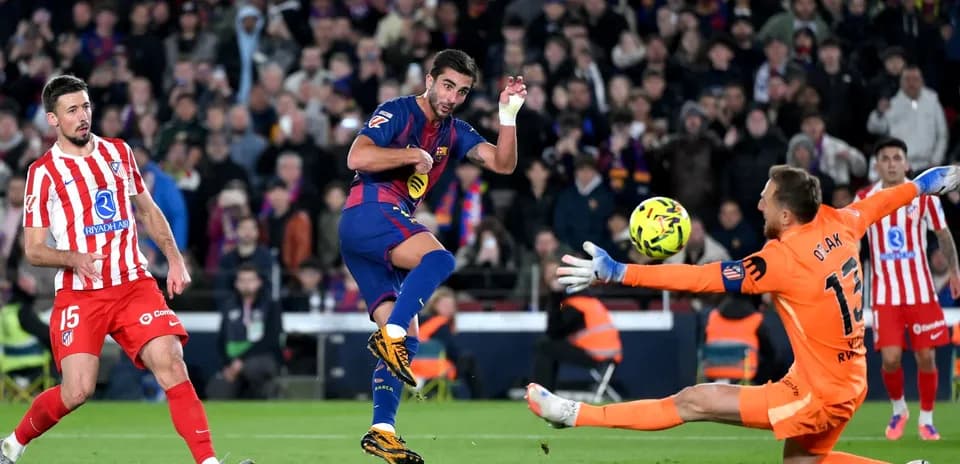Barcelona player attempting to score against Atletico Madrid