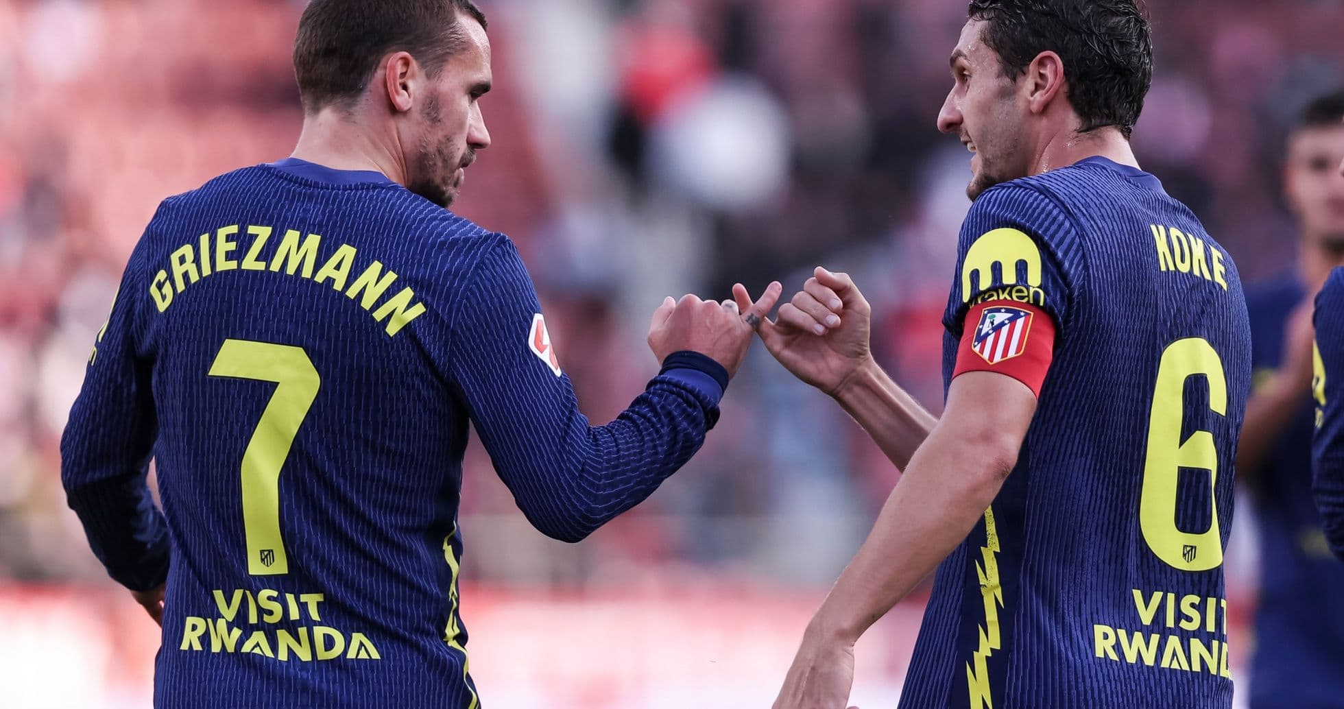 Griezmann and Koke celebrating during match
