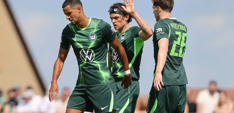 Wolfsburg players celebrating after a goal