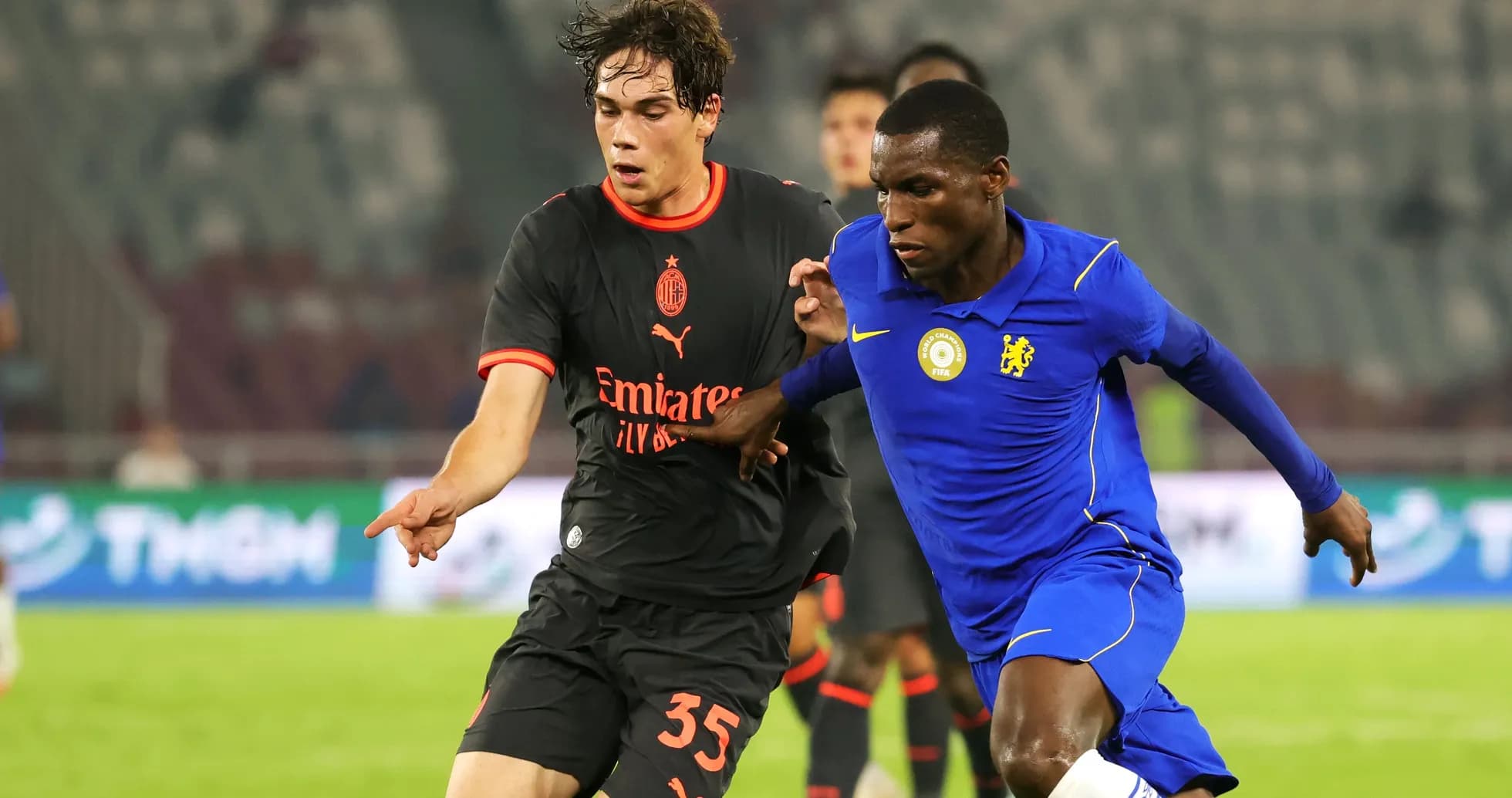 AC Milan and Chelsea players competing for the ball