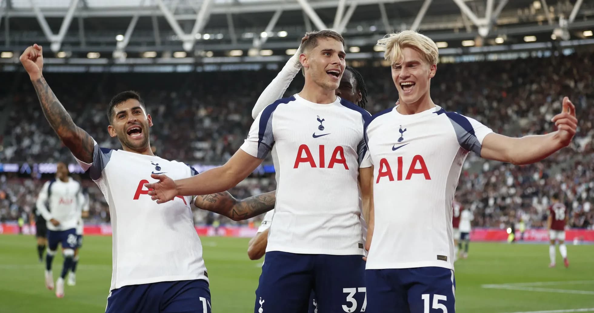 Tottenham players celebrating a goal on the pitch