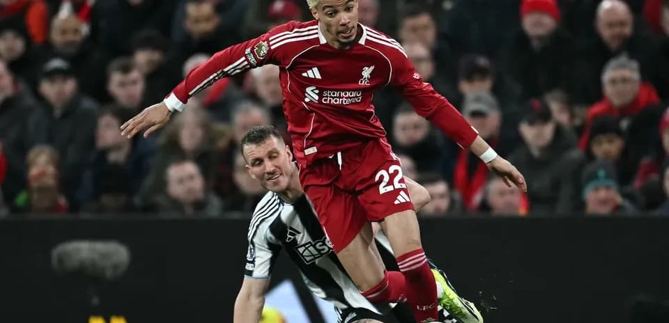 Liverpool player tackled by Newcastle defender