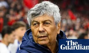 Coach observing players during a match