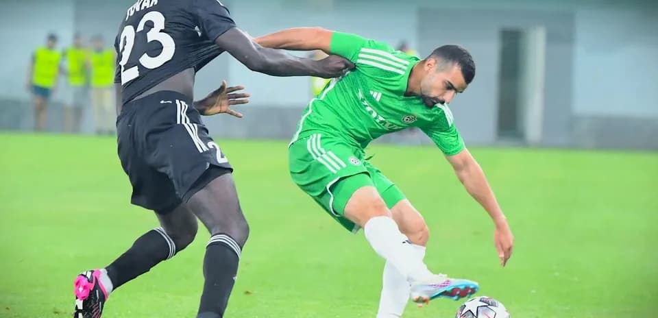 Player challenging for the ball during match