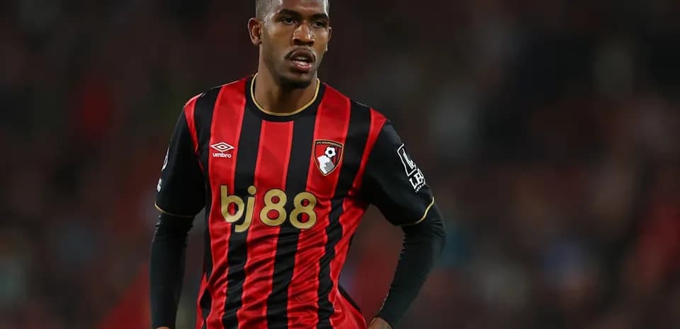 Bournemouth player in red and black jersey during match