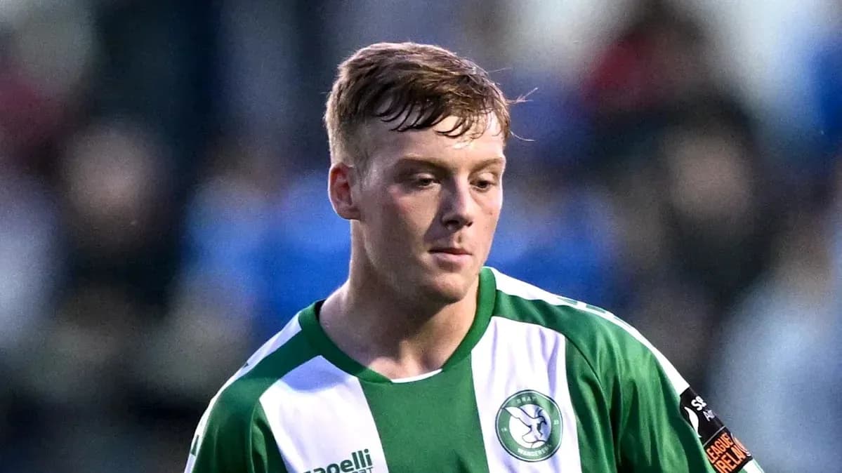 Player in green and white kit during match