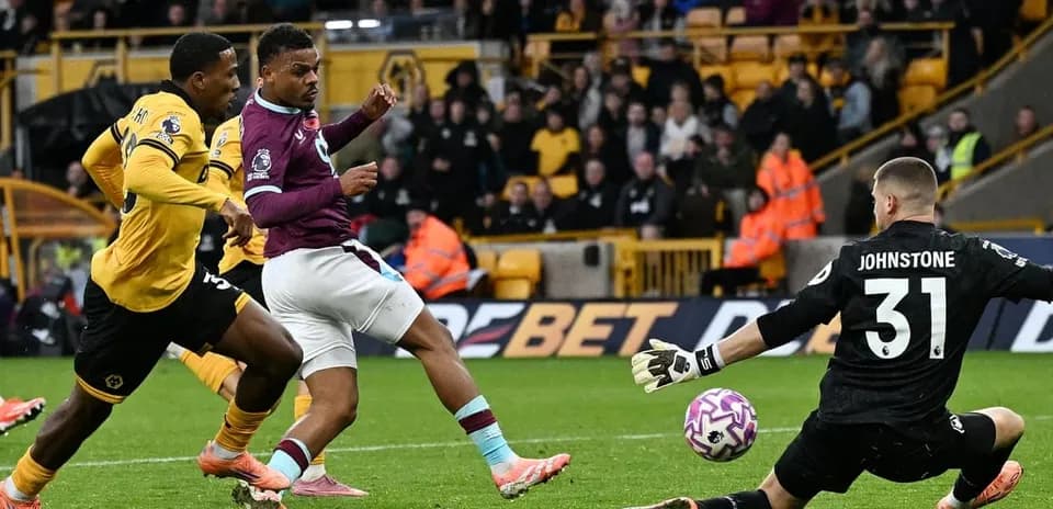 Player shooting at goal during Burnley vs Wolves match