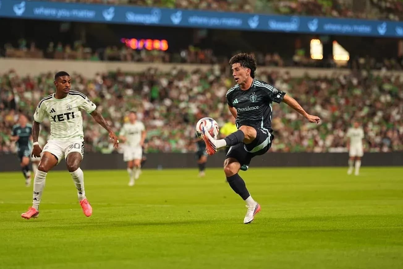 Seattle Sounders player kicking the ball