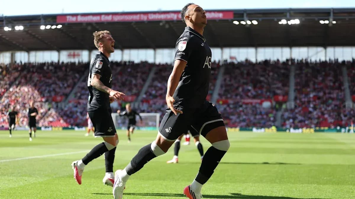 Swansea City player celebrating a goal during match