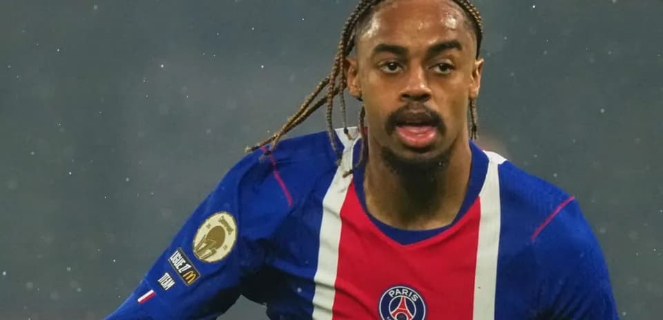 Player running with ball in Paris Saint-Germain jersey
