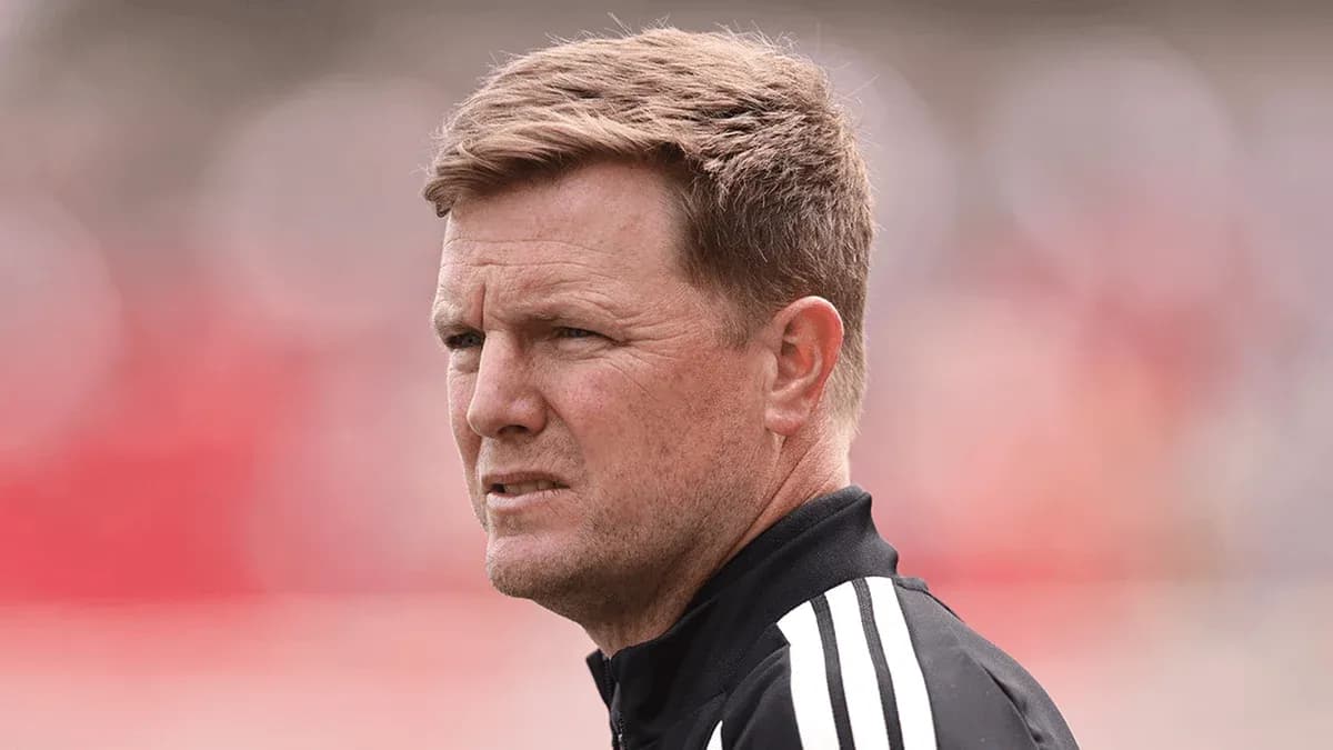 Coach observing match with focused expression