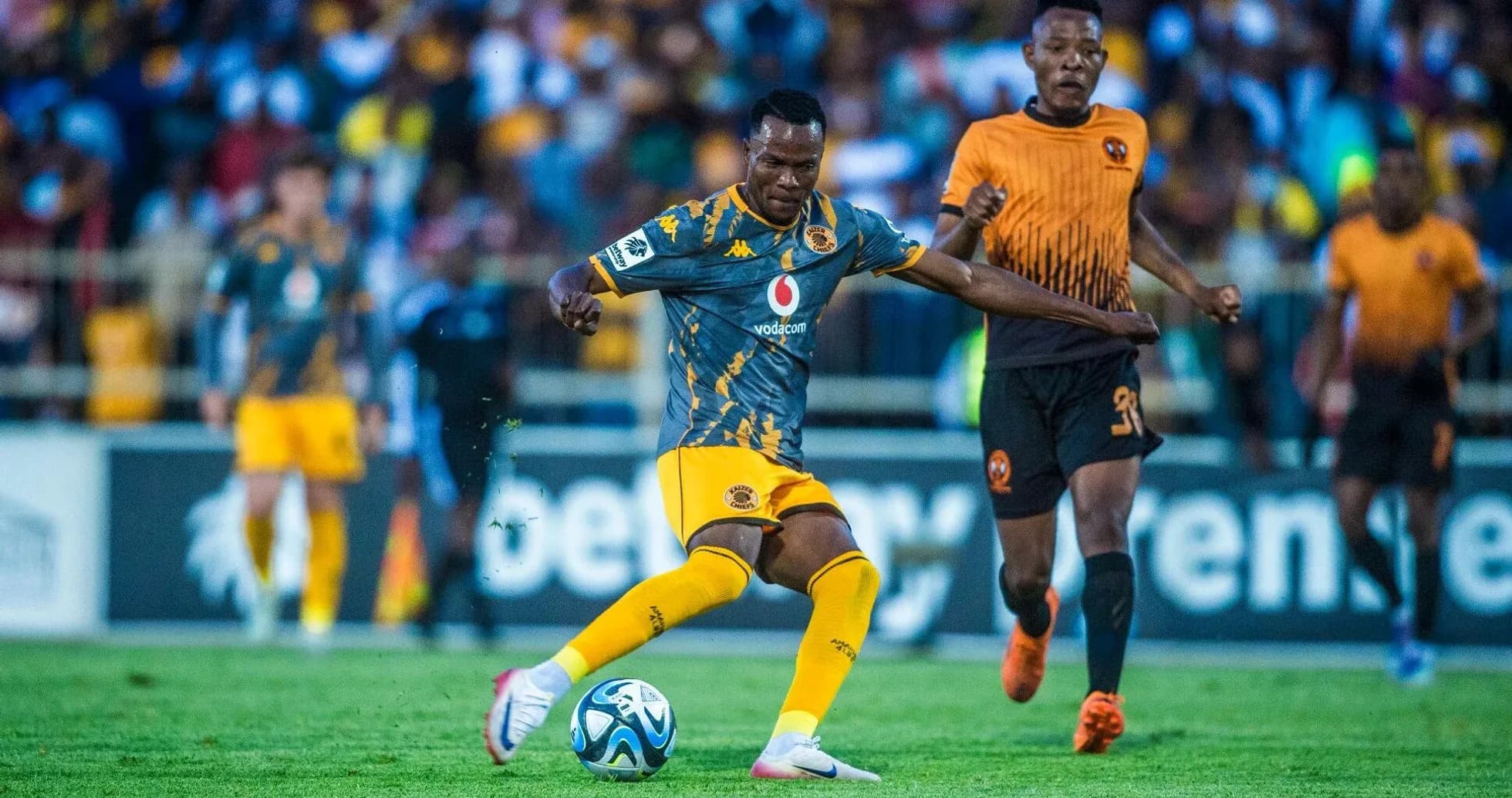 Player dribbling ball during a football match