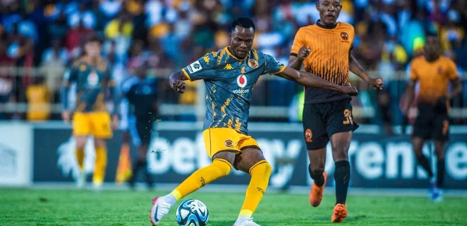 Player dribbling ball during a football match