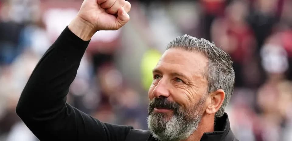 Coach celebrating with a raised fist during match