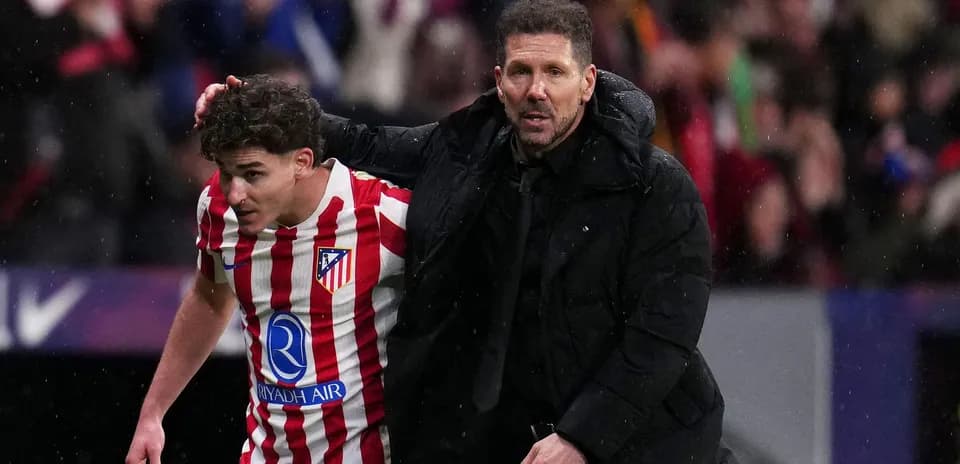 Coach assisting player off the field during match