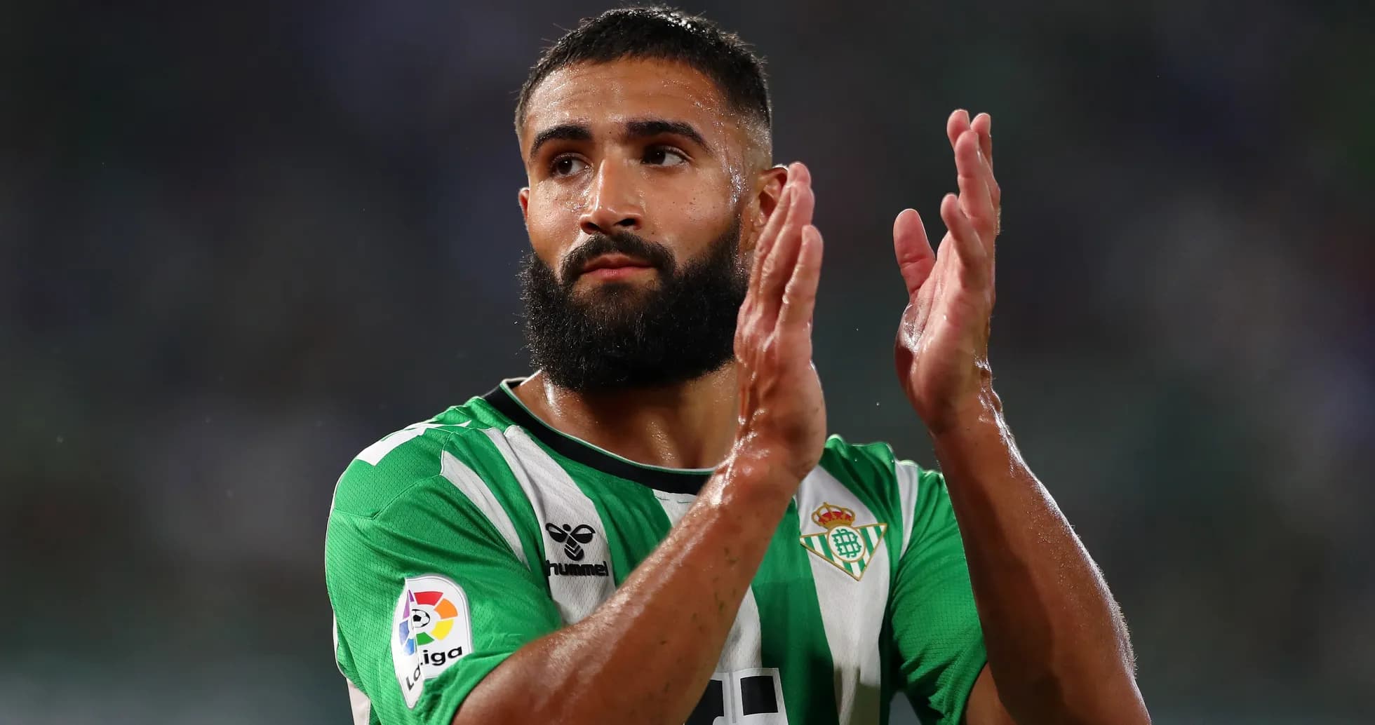 Real Betis player applauding fans after match