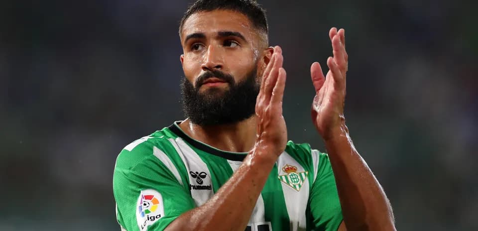 Real Betis player applauding fans after match