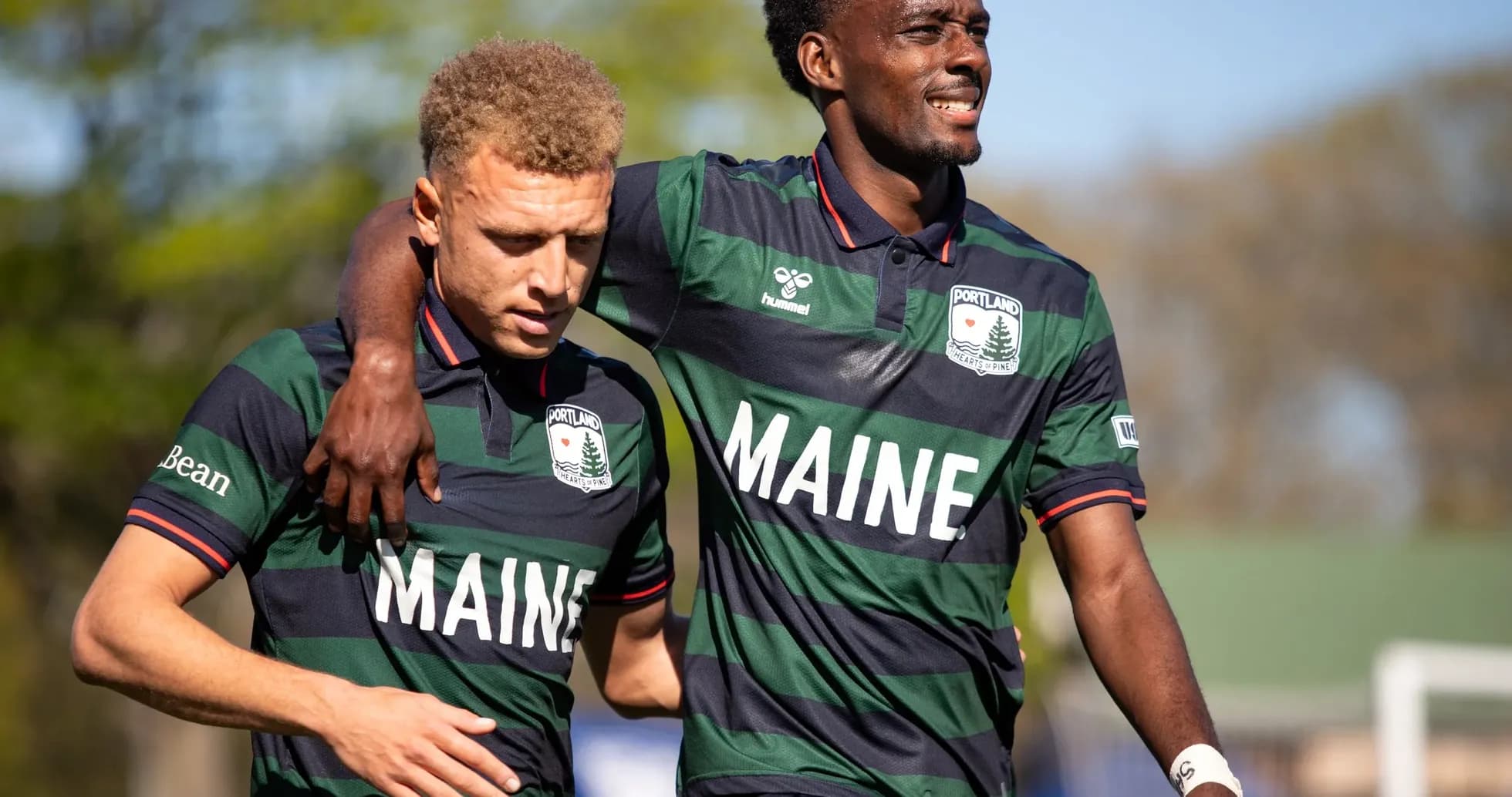 Two players celebrating for Portland Hearts of Pine