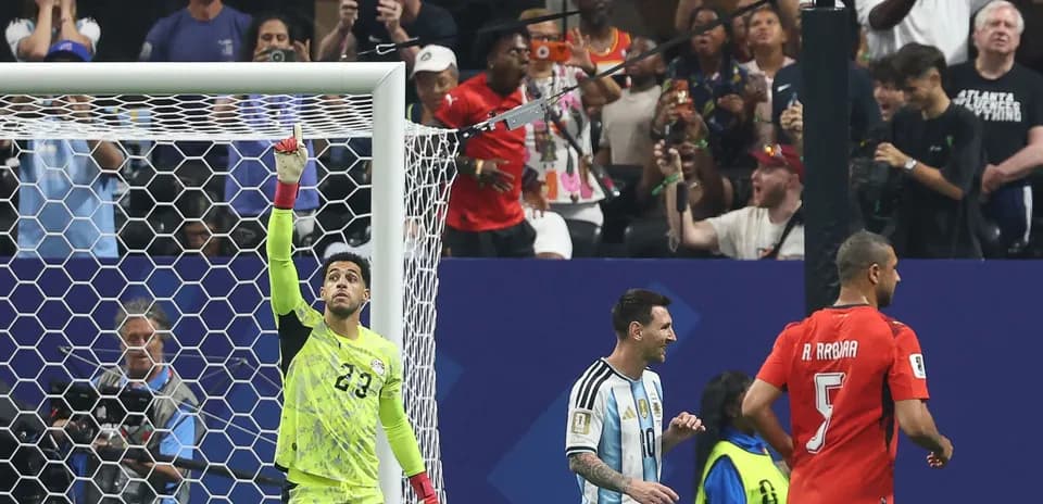 Goalkeeper celebrating with Messi and teammates