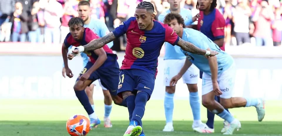 Barcelona player taking a penalty kick