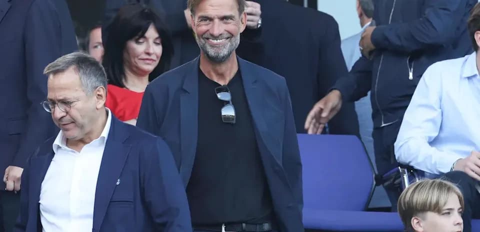Jurgen Klopp smiling in a crowd at an event
