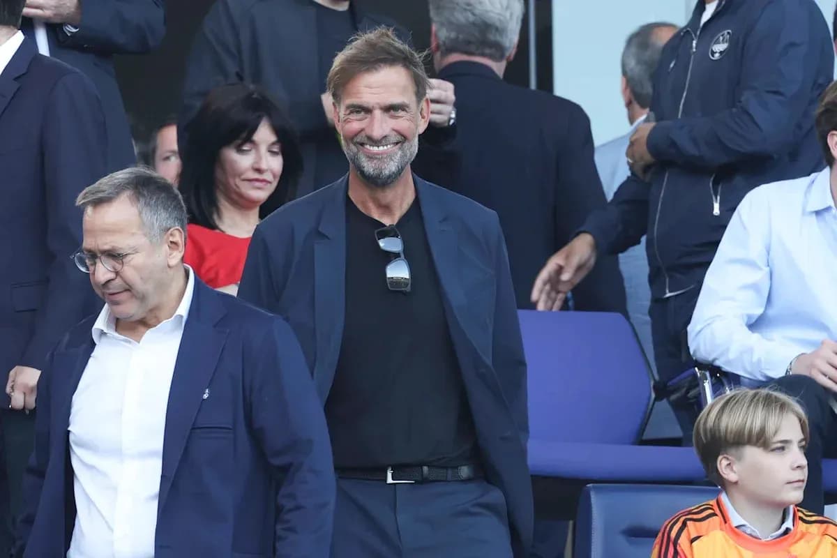 Jurgen Klopp smiling in a crowd at an event