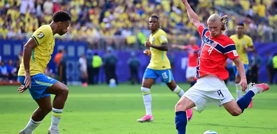 Brazil player defending against Norway forward