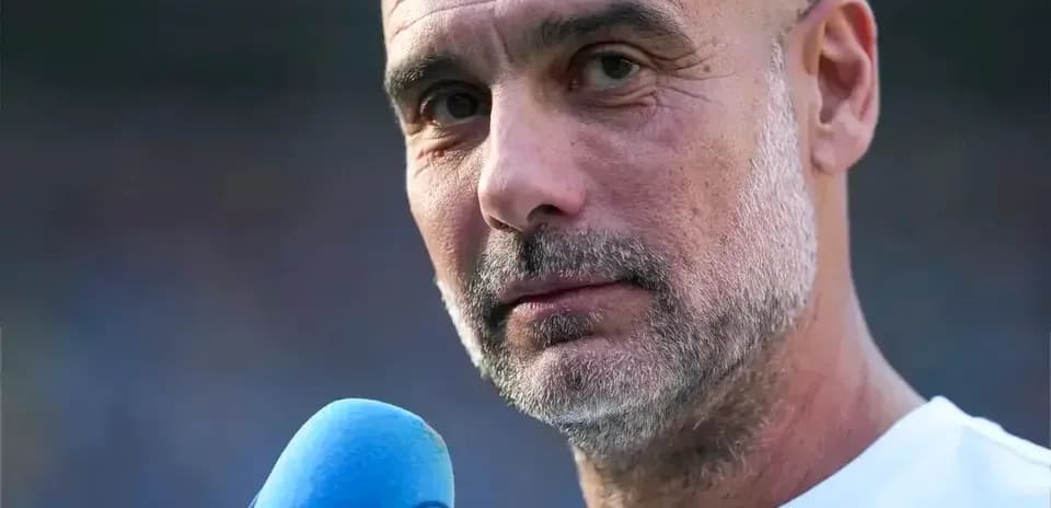 Manager speaking into microphone during interview