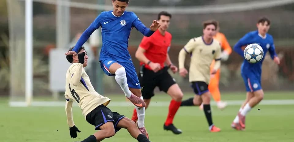 Player in blue jumps over opponent during match