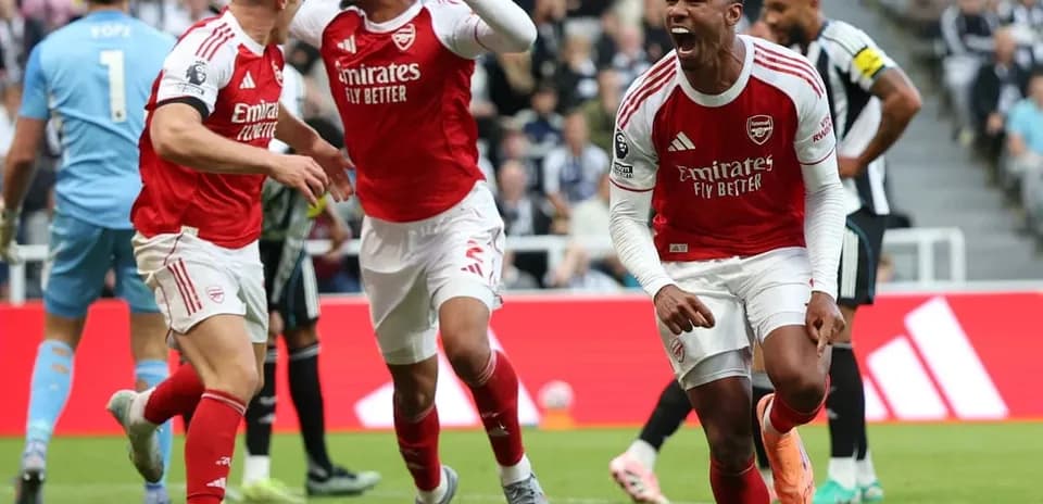 Arsenal players celebrating a goal against Newcastle