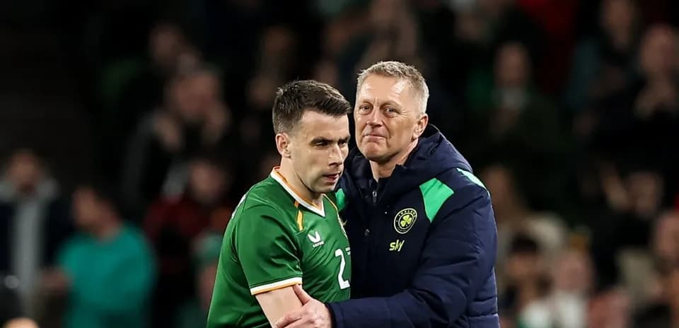 Manager embracing player during a football match