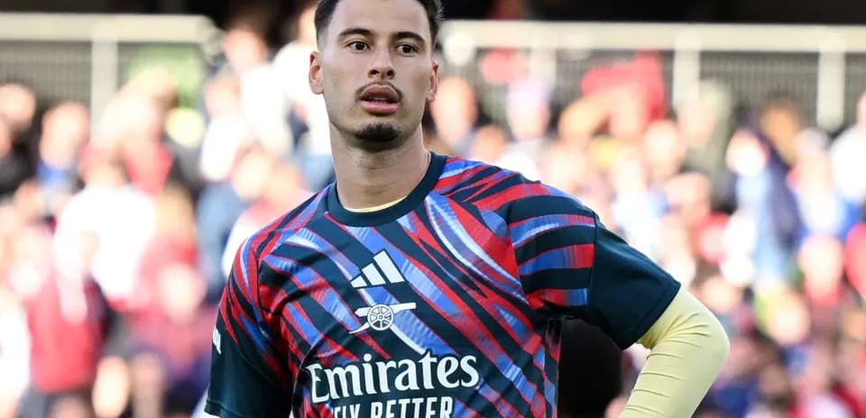 Goalkeeper wearing Arsenal kit during match warm-up